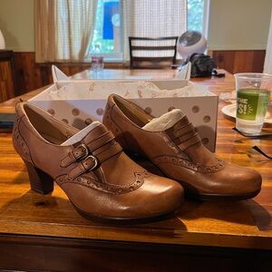 Brown leather clogs